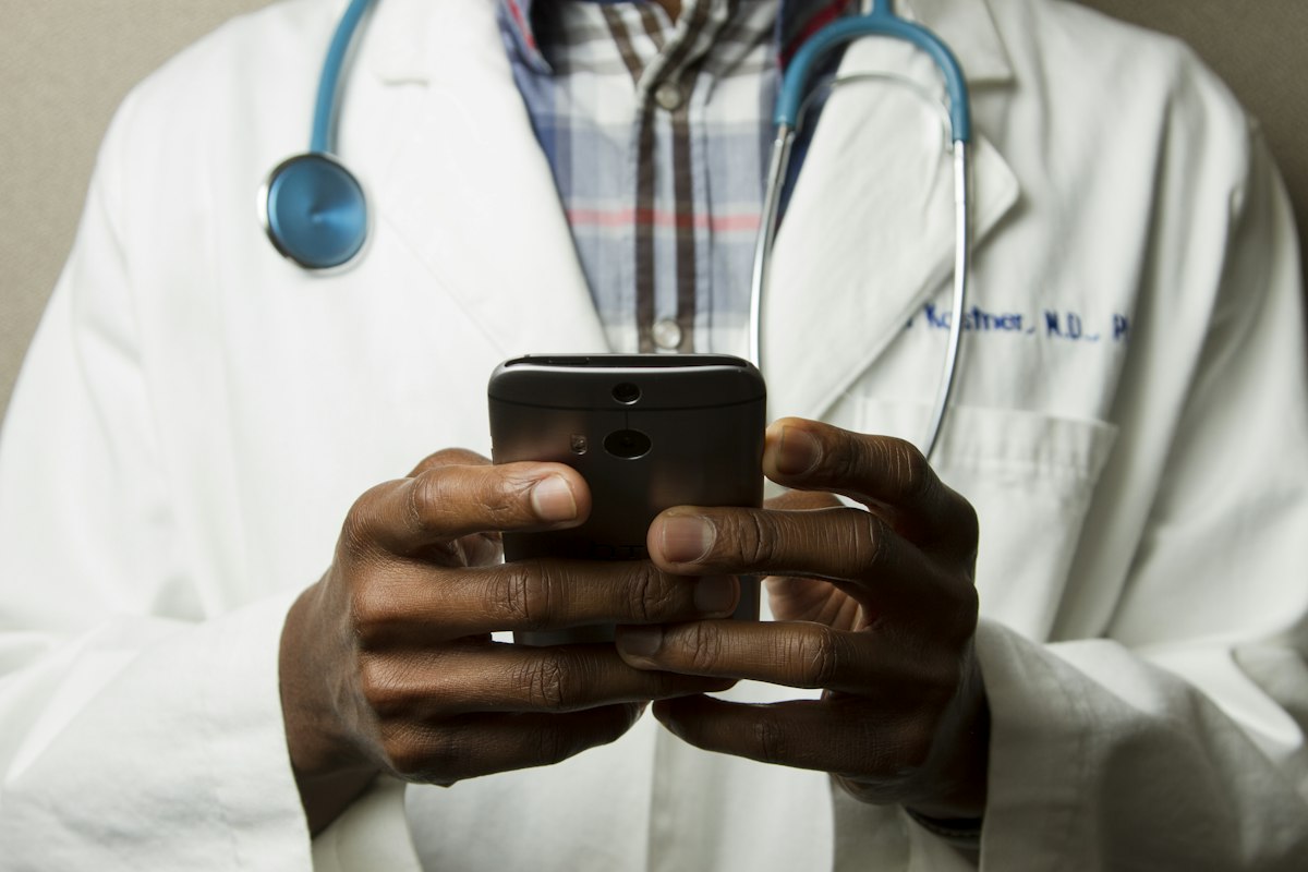 Doctor reviewing health insurance coverage charts with patient